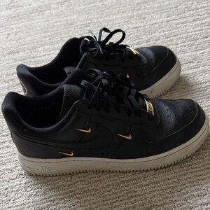 Nike Black Air Force 1 Sneakers with Gold Details